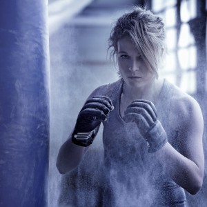 Female boxer in an abandoned warehouse.